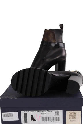 Boots à boucles Louis Vuitton Noir en Cuir