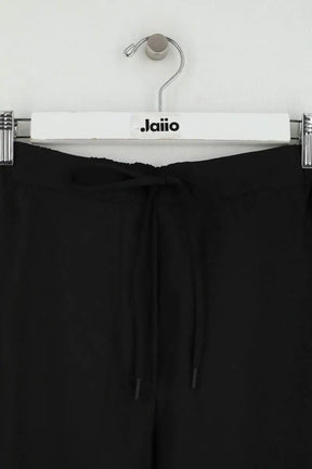 Pantalon droit Sandro Noir en Synthétique