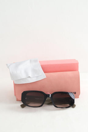 Lunettes de soleil Miu Miu  Noir