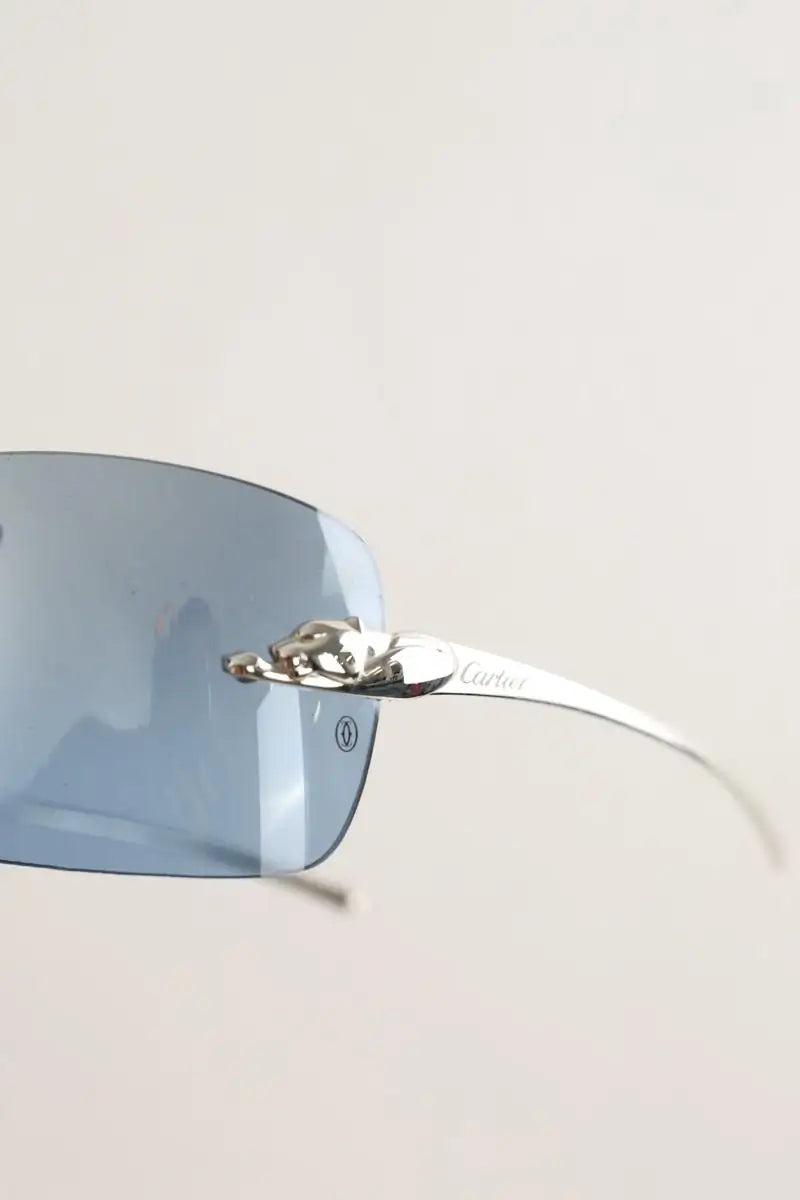 Lunettes de soleil Cartier Argent en Métal