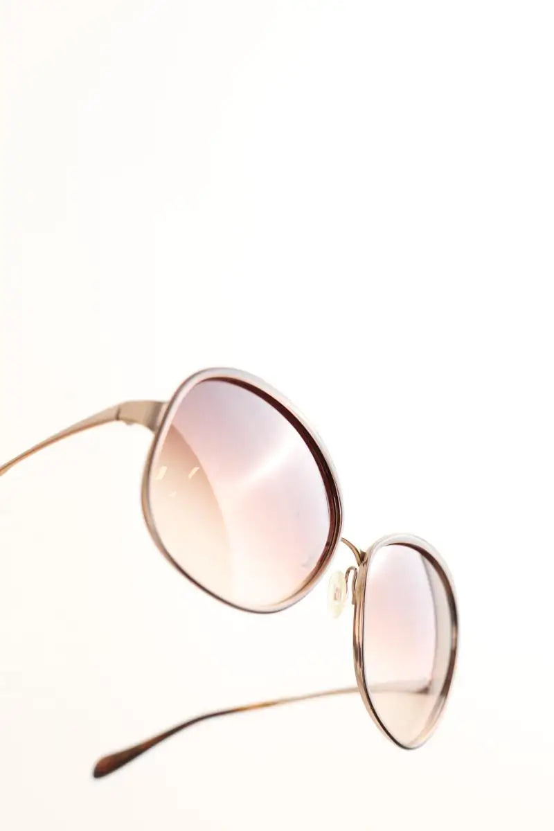 Lunettes de soleil Oliver Peoples Marron en Métal