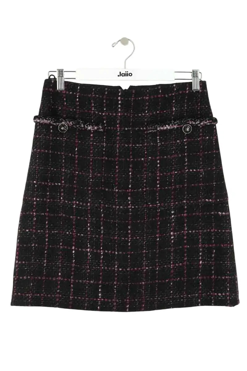 Mini jupe Chanel Noir en Tweed, taille M - Seconde Main