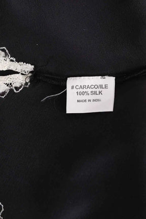 Top sans manche Maje Noir en Soie